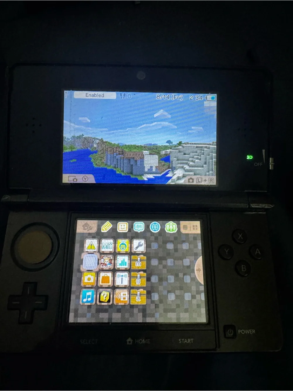 Black Nintendo 3ds with charger and cradle